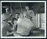 Robert Ryan and extras in Escape to Burma