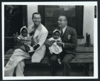 Malcom St. Clair and Jed Prouty with babies in a candid shot on the set of Everybody's Baby