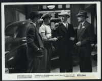 Edward Pawley, Marc Lawrence and other unidentified actors in a scene from Eyes of the Underworld.