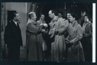 Spencer Tracy reprimands Douglas Spencer as others look on in a scene from Father Of the Bride.