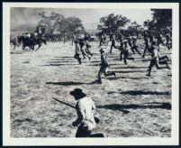 Unidentified cast members and extras in an action scene from The First Texan