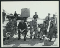 Producer Edmund Grainger, General A. H. Noble and Robert Ryan with others on the set of Flying Leathernecks