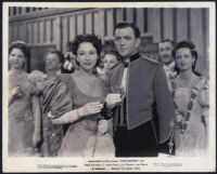 June Duprez, John Clements and cast members in the wedding toast scene from The Four Feathers
