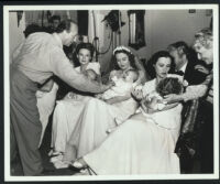 Director Michael Curtiz, actors Priscilla, Lola and Rosemary Lane, Gale Page, Claude Rains and May Robson in Four Wives