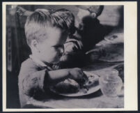 Child eating in Pare Lorentz's documentary The River