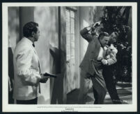 Alan Ladd, Morris Carnovsky, and an unidentified actor in a scene from Saigon