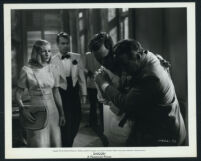 Veronica Lake, Alan Ladd, Douglas Dick and some unidentified actors in a scene from Saigon