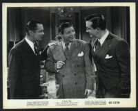 Robert Montgomery, Harry Von Zell and John Payne in a scene from The Saxon Charm