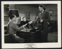 Actors in a scene from The Scarf