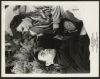 Actors in a scene from The Scarf