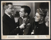 Robert Young, Douglas Dick and Ann Richards in a scene from The Searching Wind