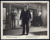 Lloyd Corrigan and unidentified actors in a scene from Shadowed