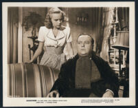 Lloyd Corrigan and Terry Moore [credited as Helen Koford] in a scene from Shadowed