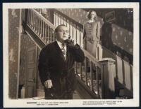 Lloyd Corrigan and Anita Louise in a scene from Shadowed