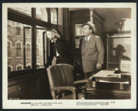 Anita Louise and Lloyd Corrigan in a scene from Shadowed