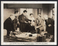 Cast members in a scene from Shake Hands With Murder