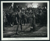 Kirk Douglas, John Dall and extras in a scene from Spartacus