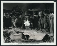 Extras reading a battle map in a scene from Spartacus