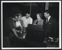 Director Dick Powell and actors Jan Sterling, Stephen McNally, Alexis Smith, and Richard Egan in Split Second
