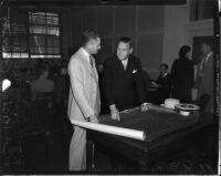 Col. Richard Barnitz meets with Archibald Young over airport improvement plans, Los Angeles, 1935