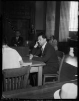 Kent Parrot, politician and attorney, sits in a courtroom, Los Angeles, 1930s