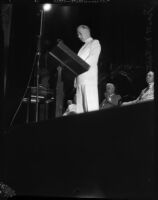 Scott M. Loftin, Democratic politican from Florida, speaks at a podium, Los Angeles, 1930s