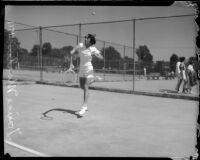 Louise Martin plays tennis, Los Angeles, 1930s
