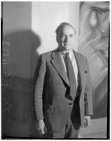 Portrait of Leo Katz standing next to his 