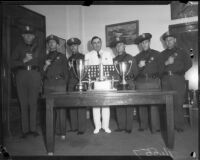 Police team members with the awards won in a shooting competition with officers from Argentina, Los Angeles, 1938