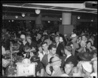 Crowd shops at May Company department store during Dollar Day sale, Los Angeles, 1935