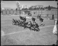 UCLA football team practices their formation on Spaulding Field, Los Angeles, 1930s