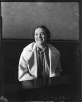 Evangelist Rheba Crawford smiling on the witness stand, Los Angeles, 1935
