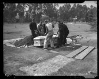 Men exhume the body of Mrs. Mary James, Los Angeles, 1936
