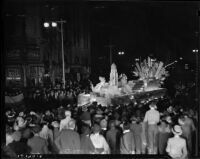 Crowd watching a float pass by during the Hoover Dam Power Inaugural, Los Angeles, 1936