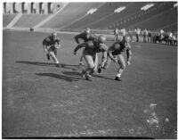 Washington Huskies practice before a game at the Coliseum, Los Angeles, 1936