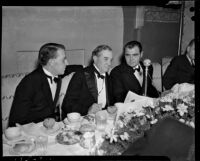 John Anson Ford, Tom Connolly and Peirson M. Hall dressed in tuxedos at a banquet, Los Angeles, 1930s