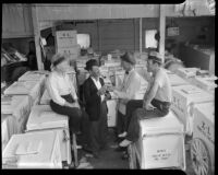Striking ice cream vendors sit on push carts, Los Angeles, 1937
