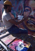 David Botello painting mural in East Los Angeles