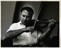 Isaac Stern playing the violin, 1958 [descriptive]