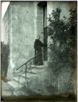 Priest entering the side door to the chapel at Mission Santa Barbara, Santa Barbara, 1898