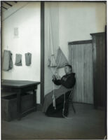 Monk working on cord-making at the Mission Santa Barbara, Santa Barbara, 1898