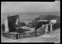 Tide Rock shell vendor stand on bluff above a beach, Santa Monica Bay, circa 1920-1930