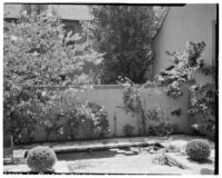 Laura La Plante residence, view of patio, pond and wall, Beverly Hills, 1929