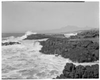 Pacific Ocean waves crash into rocky coast, Ensenada, 1926