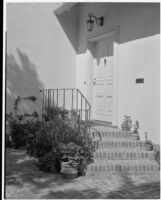 Barton Hepburn residence, doorway with potted plants, Beverly Hills, 1930-1931