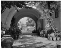 Allied Arts Guild of California, view through archway towards courtyard, Menlo Park, 1932