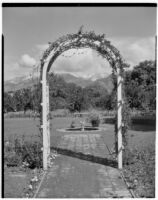 E. N. Bender residence, view through arbor towards lawn and lily pond, Pasadena, 1931