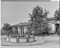 Leo V. Youngworth residence, view across entrance court with tiled fountain and flock of turkeys towards house , Baldwin Hills, 1932