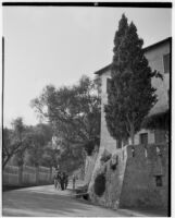 La Mortola botanical garden, view of two men walking down a road with a horse-drawn wagon, Ventimiglia, Italy, 1929