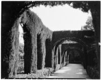 Maria Louisa Park, view from underneath an arch on a gravel walkway, Seville, Spain, 1929